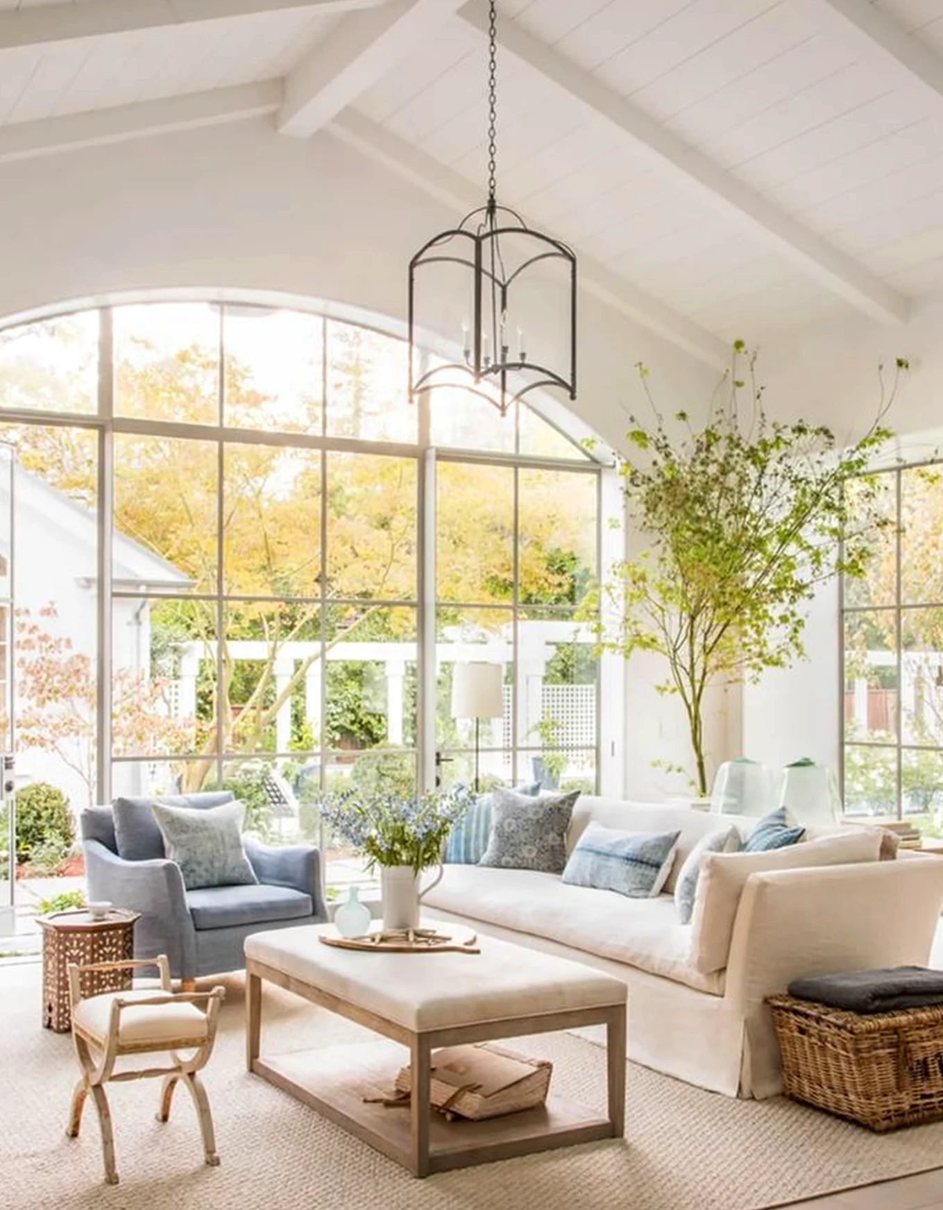Balanced fireplace area frames the view with warmth, making the scene feel open and lived-in.
