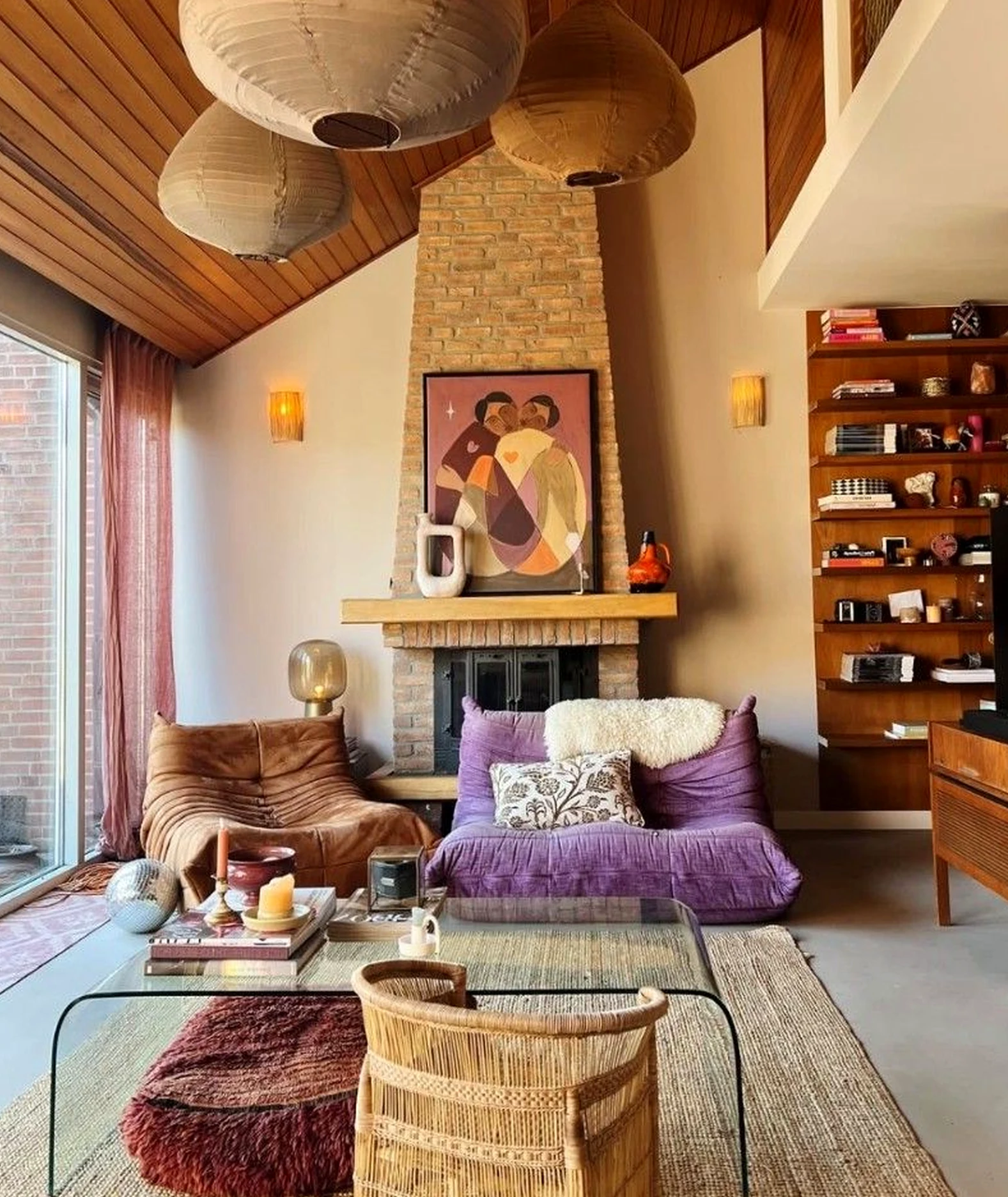 Colorful soft sofa anchors the entry with charm, giving the view a mood that feels settled and welcoming.