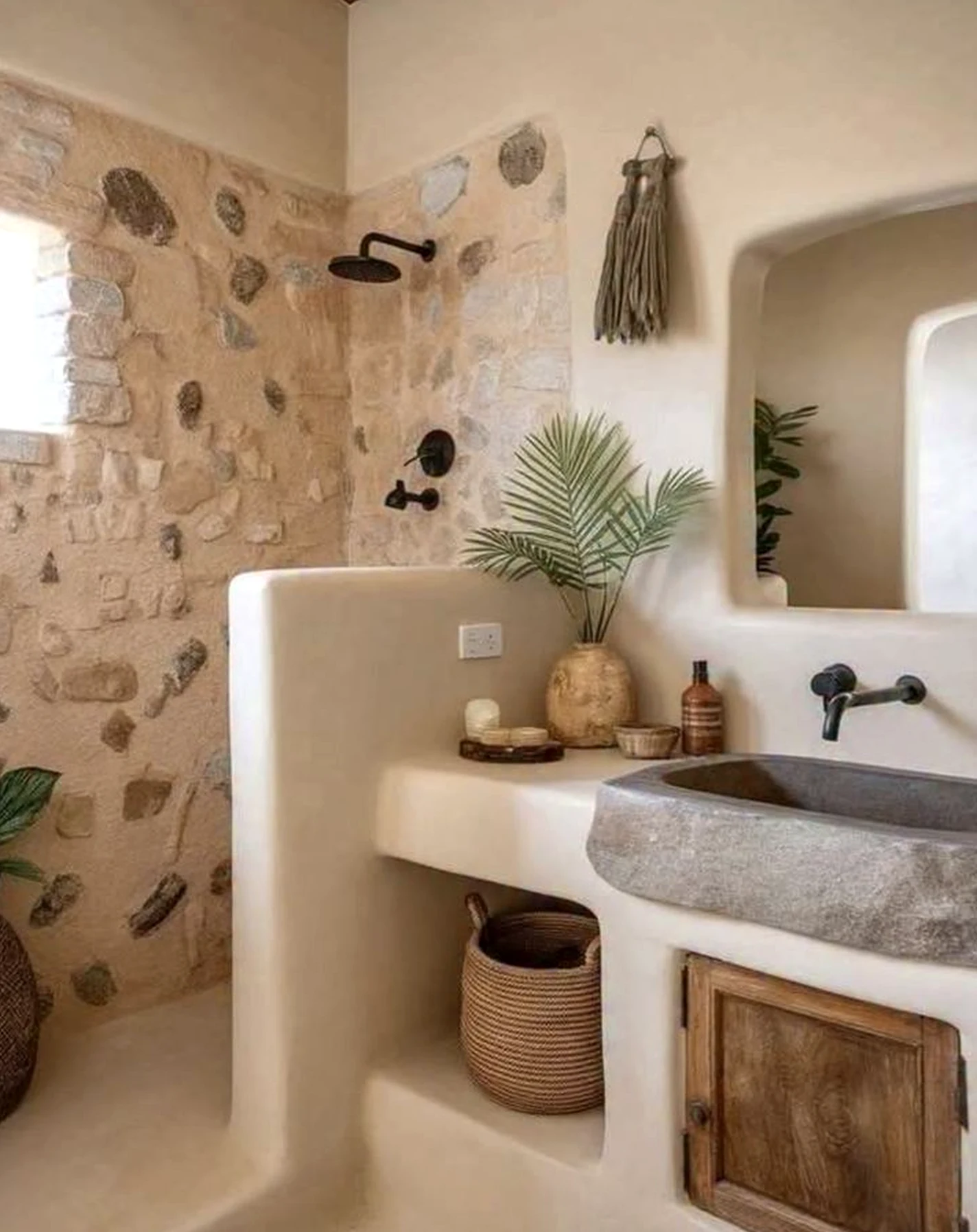 Inviting sink area anchors the design with texture, giving the view a mood that feels warm without clutter.