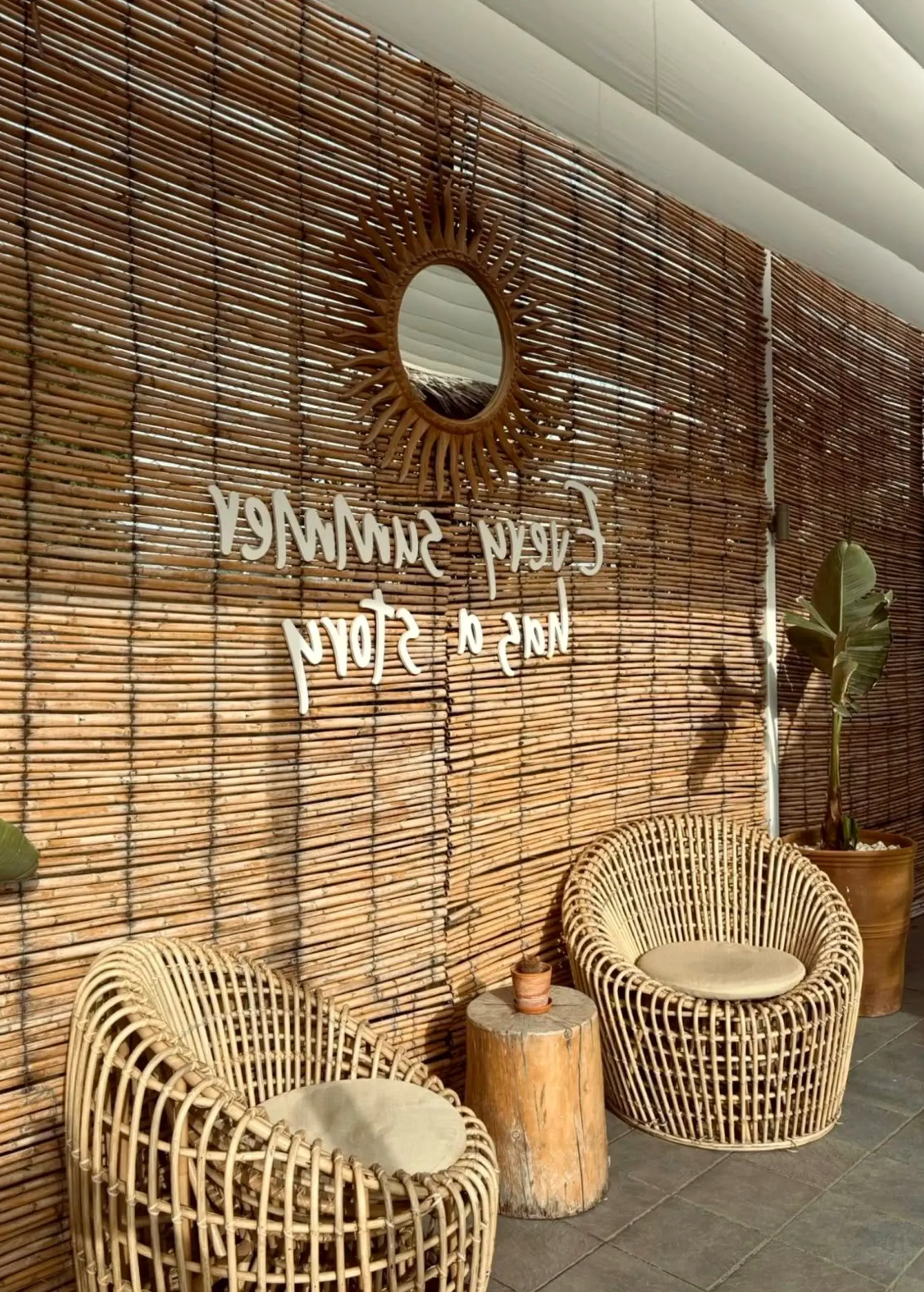 Refined stone terrace introduces comfort into the backdrop, keeping the atmosphere bright but not busy.