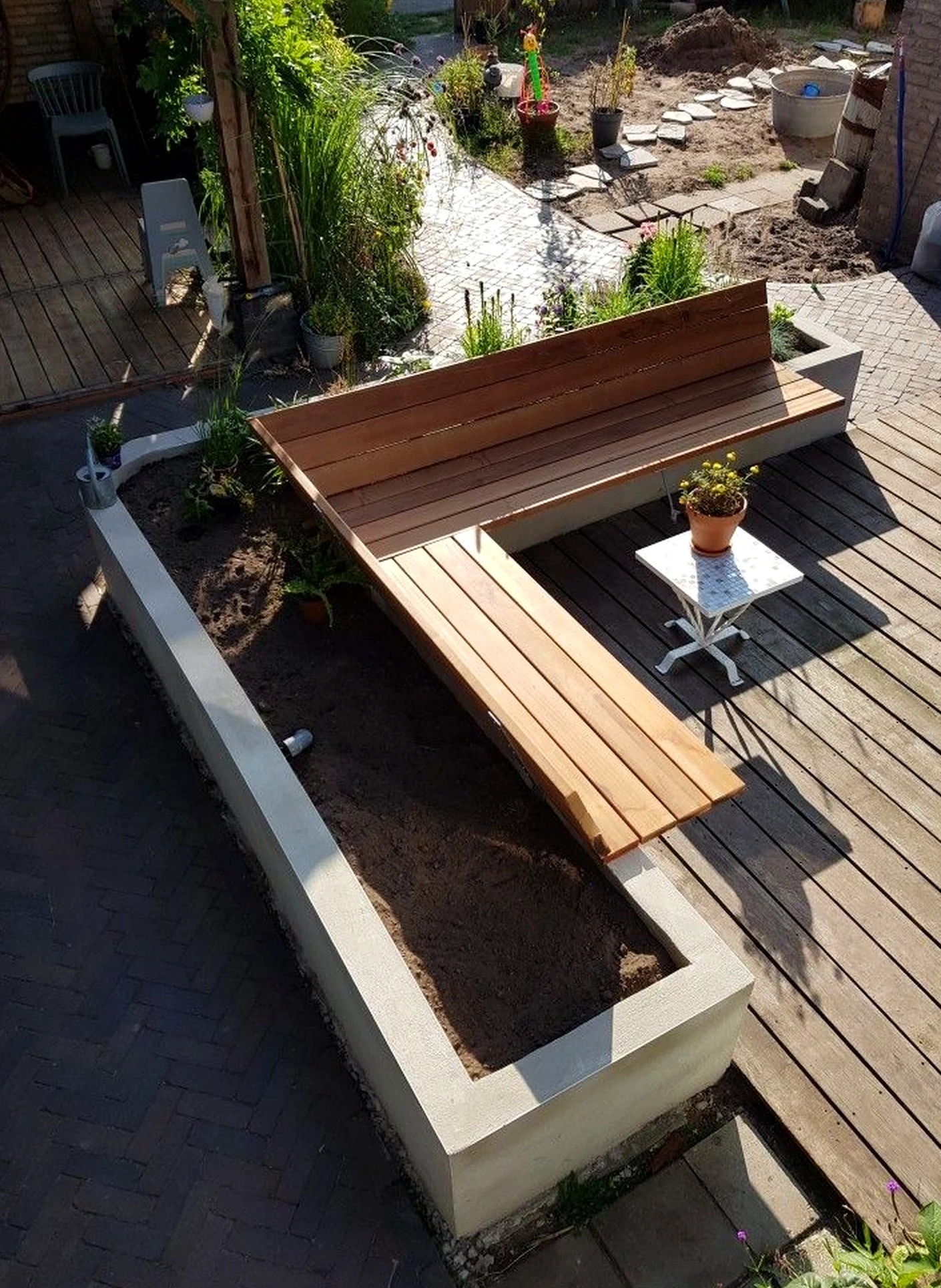 Natural soft sofa brings a useful note of detail, making the outdoor space feel personal and relaxed.