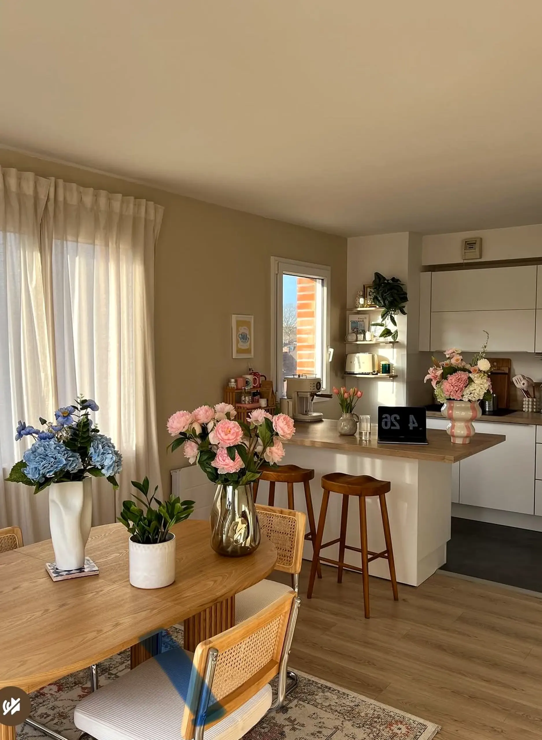 Simple wood shelving anchors the room with comfort, giving the view a mood that feels warm without clutter.
