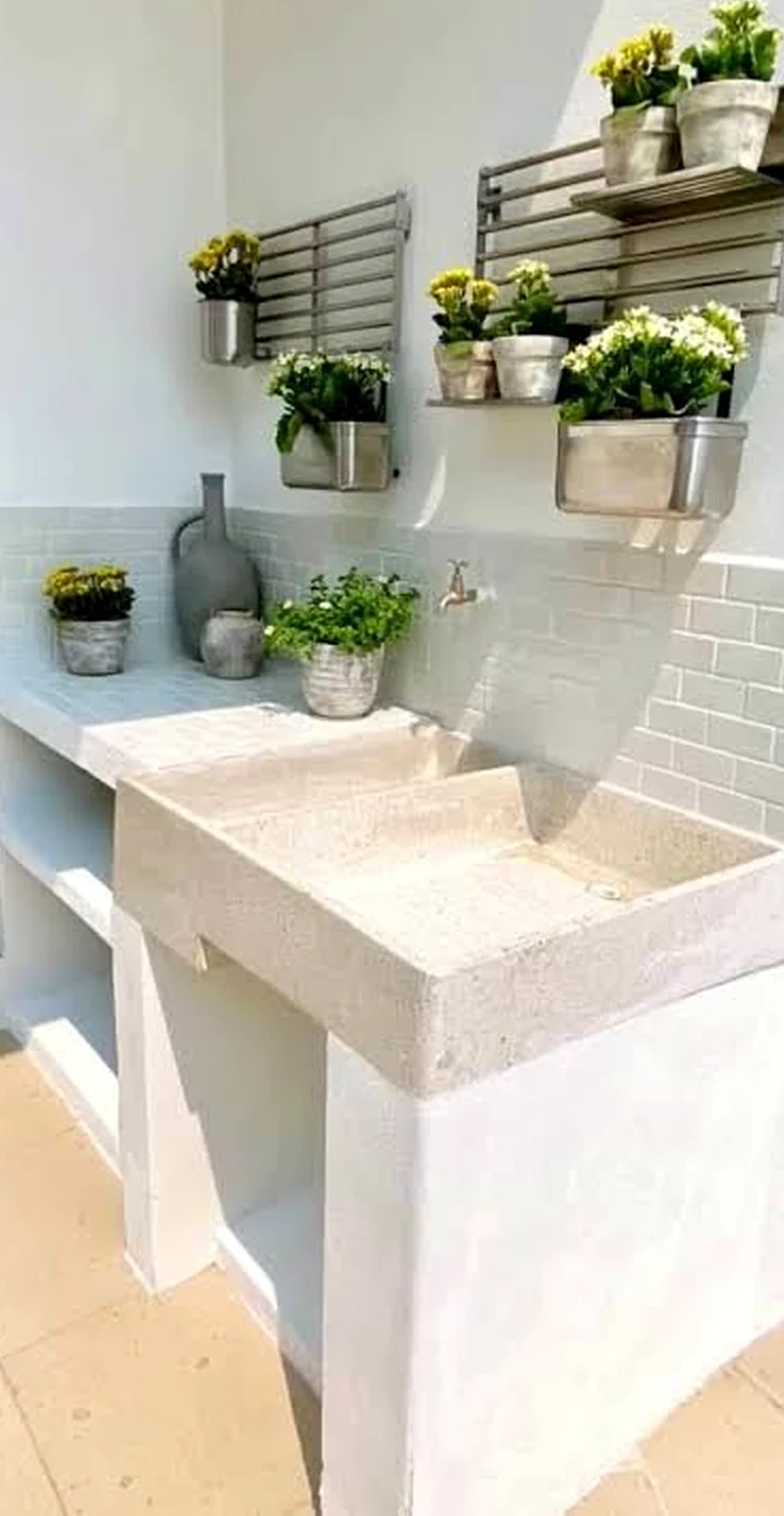 Elegant wood shelving adds a clear layer of balance, helping the entry feel personal and relaxed.